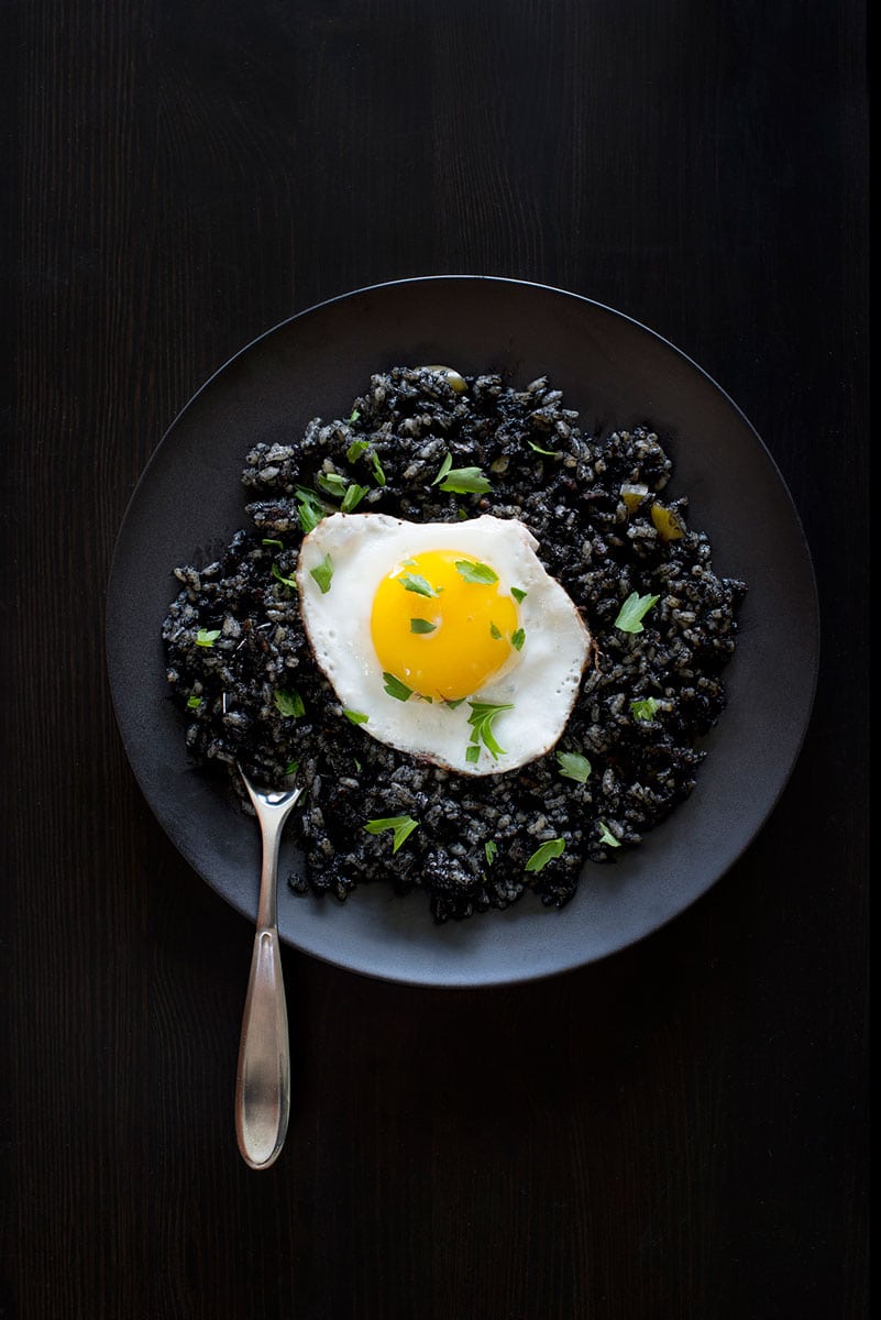Food photography of black squid rice
