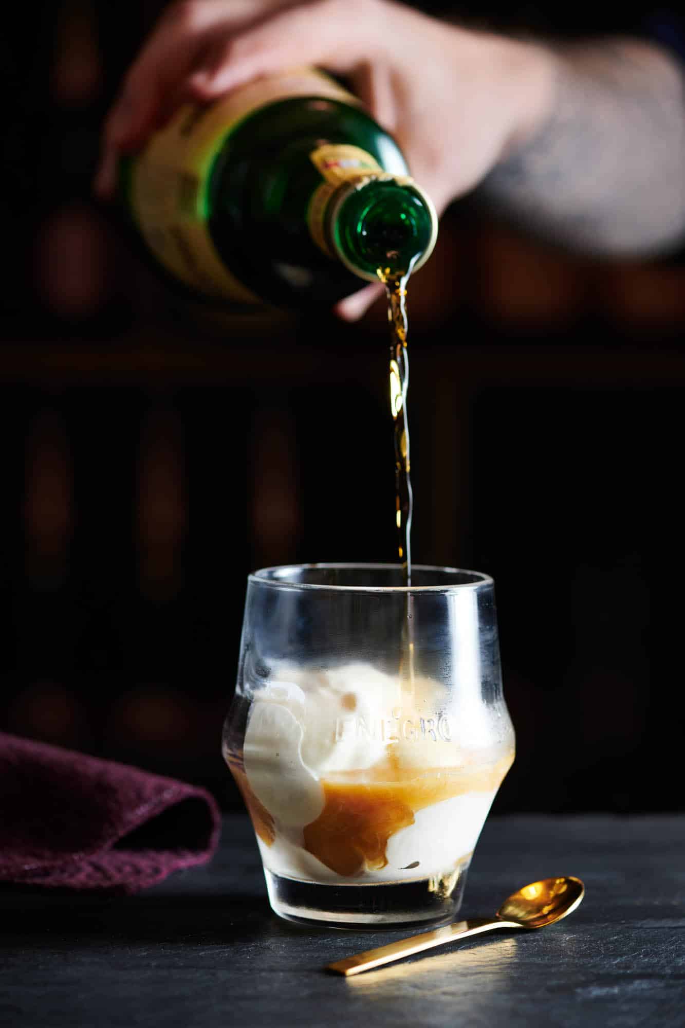 cocktail photography of Amaro Montenegro over ice cream